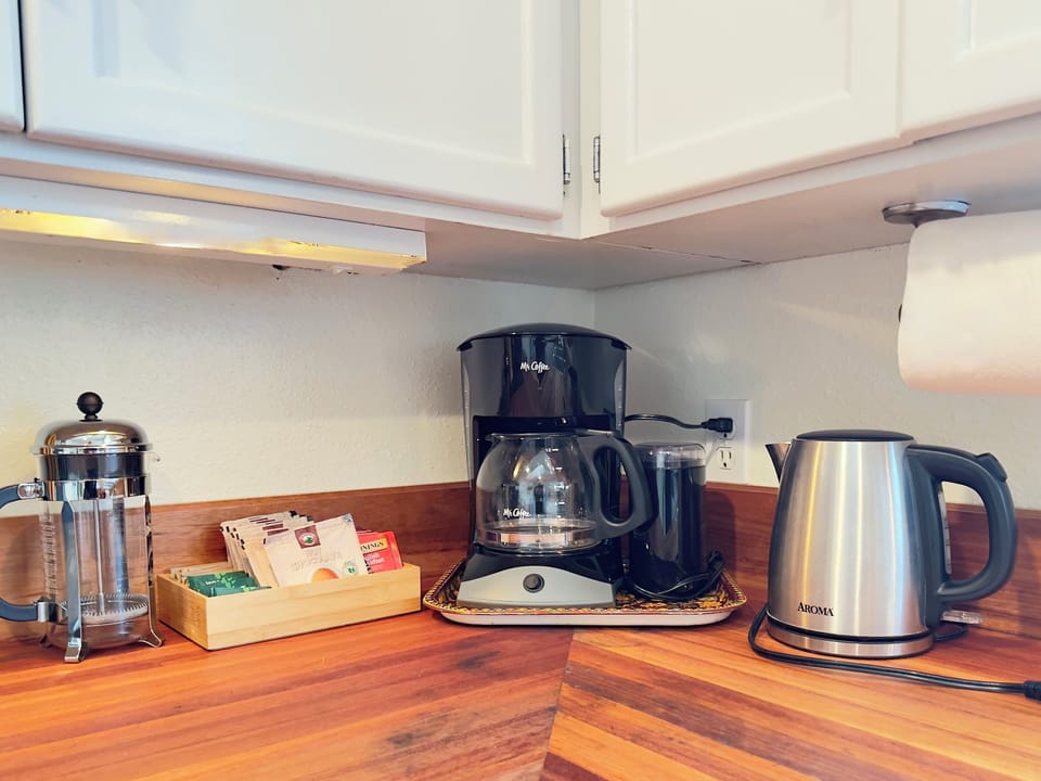 Brew a fresh pot, make a cup of tea, or press your favorite beans before heading out for the day. We’ve set up a simple coffee and tea station so slow mornings and easy starts feel right at home.