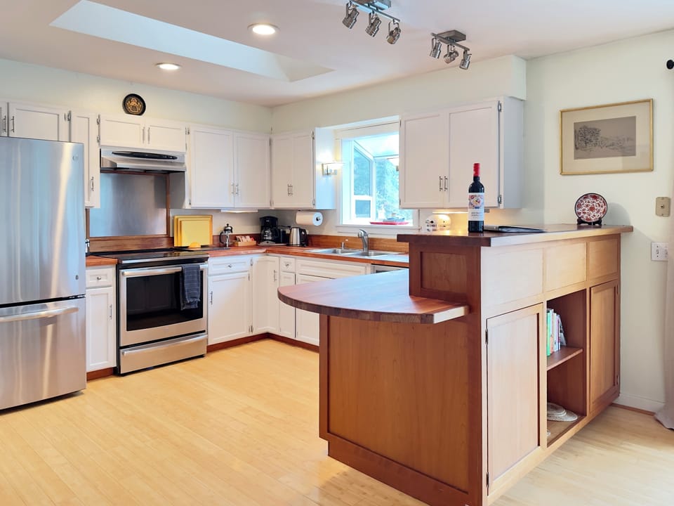 A warm, inviting kitchen made for gathering. Plenty of counter space, modern appliances, and an easy flow make it great for cooking together, sharing a glass of wine, and lingering over meals after a day on the island.