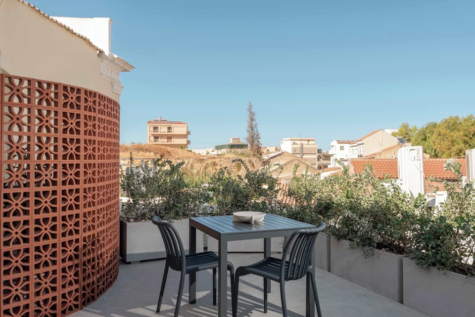 Relax on a Balcony with Seating and Scenic Cityscape