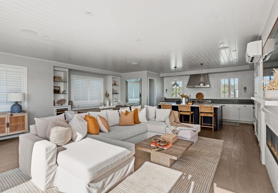 Gather in the open living room and chef’s kitchen made for entertaining