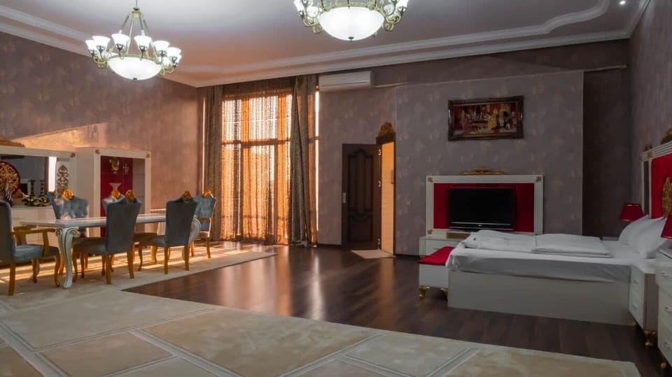 Luxury Double Room, 1 King Bed, Garden View | Living area | 84-inch TV with cable channels, first-run movies, heated floors