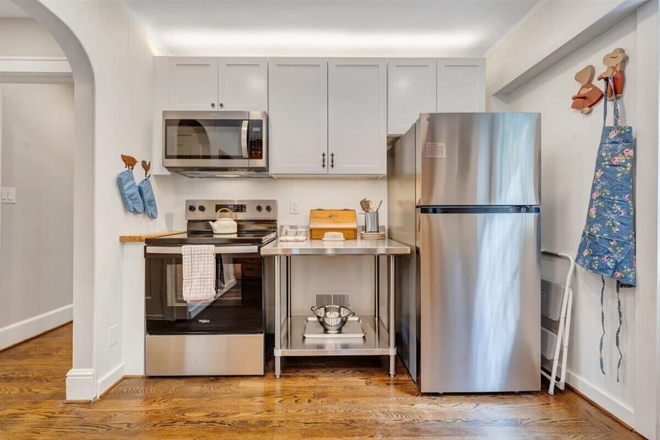 Kitchen with white cabinets and stainless steel appliances