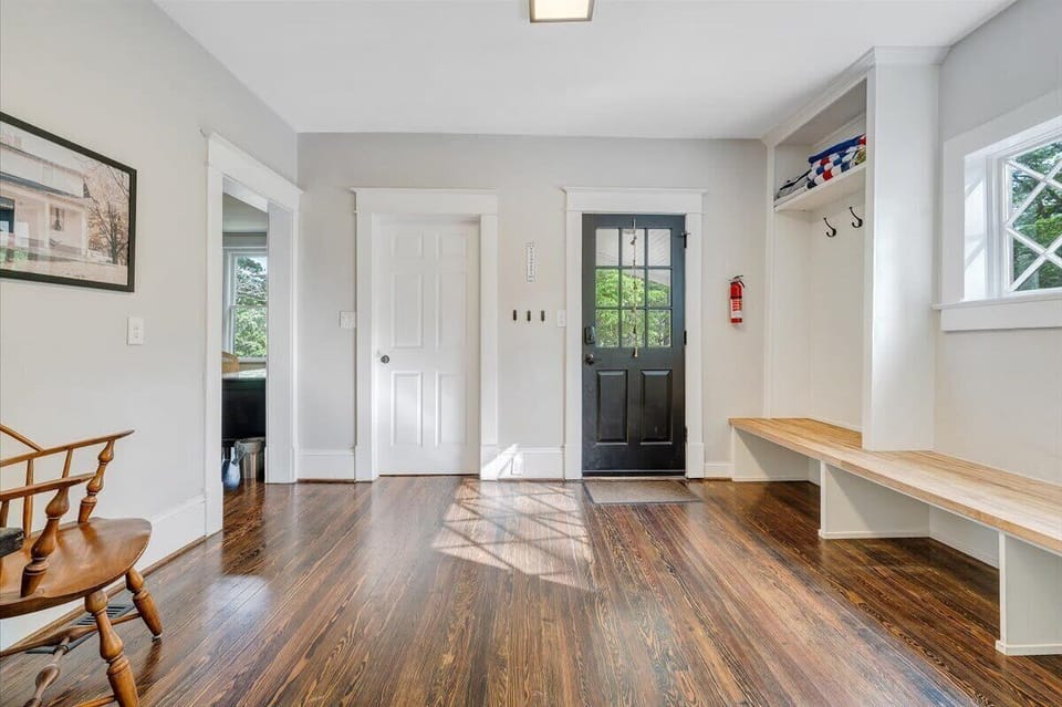 Entryway with seating bench and bright lighting
