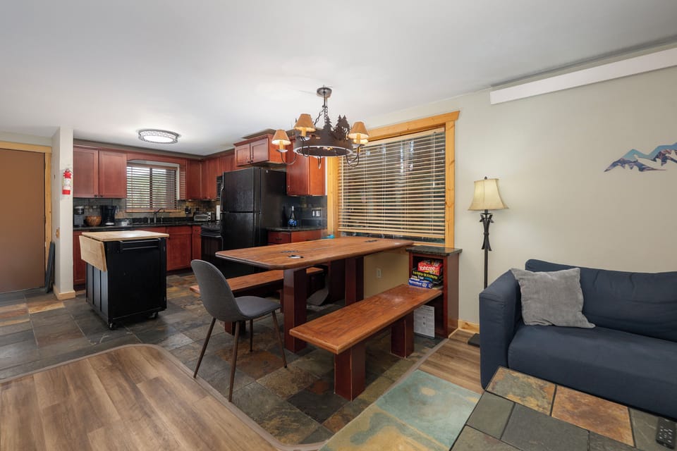 Gather around your spacious open-concept kitchen and living area, where modern comfort meets warm mountain charm for memorable meals together.
