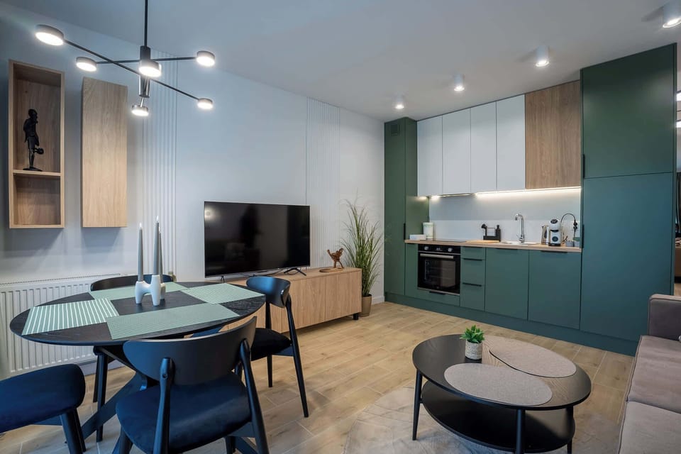 Kitchenette with plenty of kitchen utensils and dishes. 