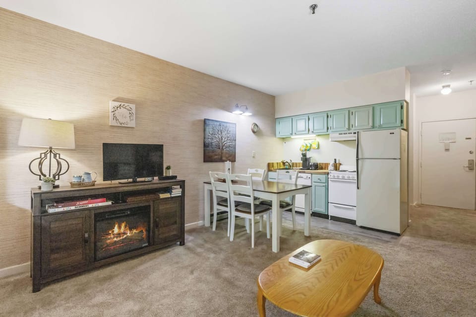 The living area flows into the kitchen, making it easy to gather, cook, and relax together after a day exploring Lincoln