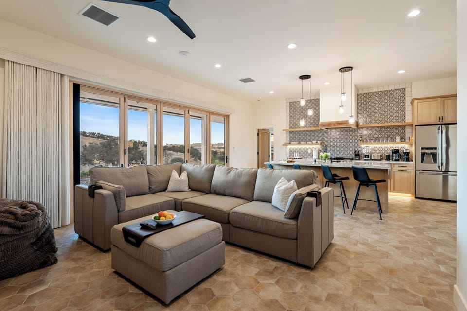 Gather around the island in the open concept lounge