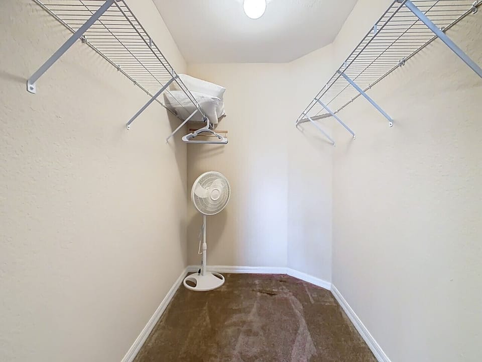 Stay organized with a spacious walk-in closet, complete with shelving and plenty of room for all your belongings during your getaway.