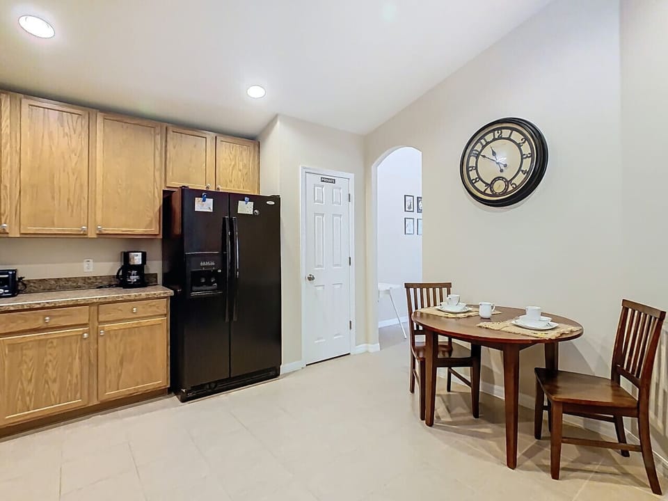 Fully equipped kitchen with a cozy dining area for your stay.