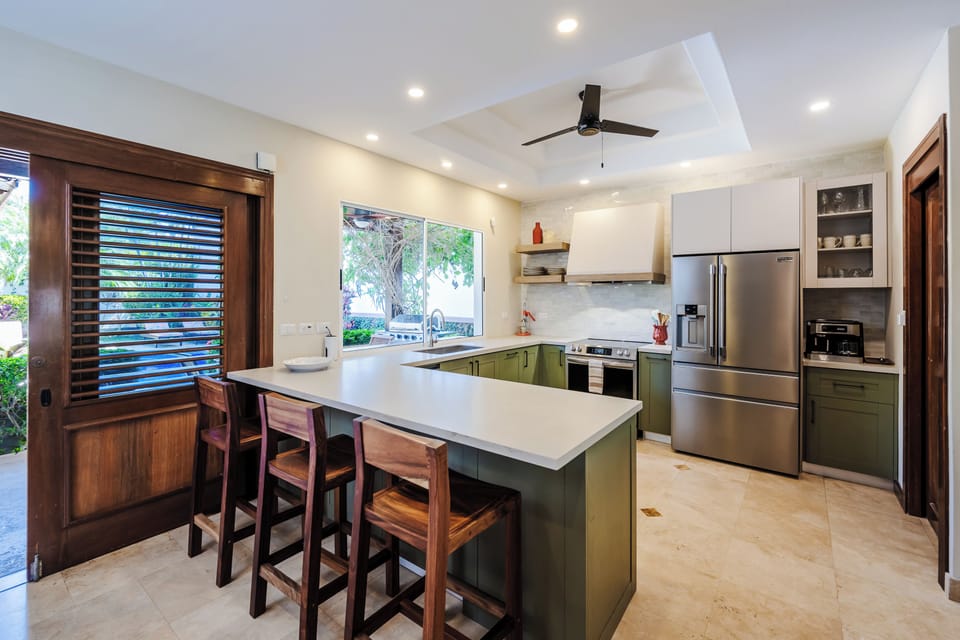 Kitchen with dishwasher, espresso/coffee machine, pass through bar window