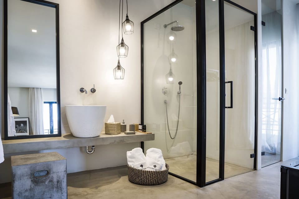 Shower, designer toiletries, hair dryer, bathrobes