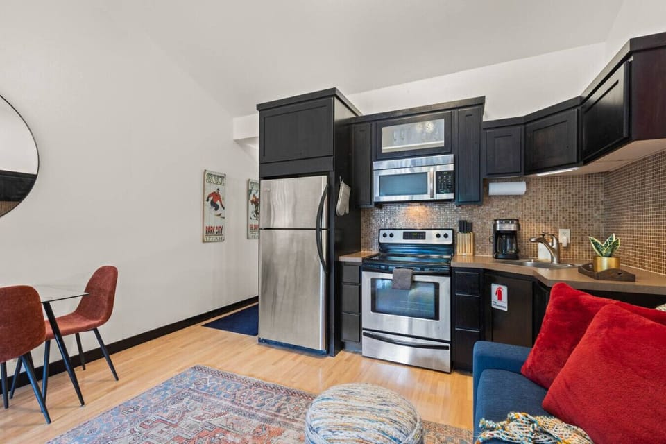 Compact and efficient kitchenette includes a fridge, microwave, oven and stovetop, coffee maker, and all the essentials to prepare light meals and snacks during your stay.
