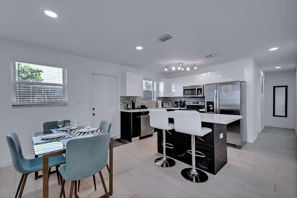 Spacious dining area with seating, ideal for meals or casual work sessions.