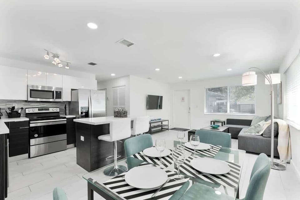 Spacious dining area with seating, ideal for meals or casual work sessions.