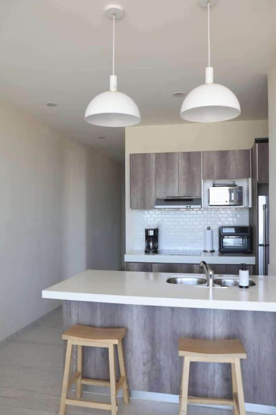 Apartment, Multiple Beds, Balcony, City View (Ocean's Point by Baja Toms) | Private kitchen | Dining tables