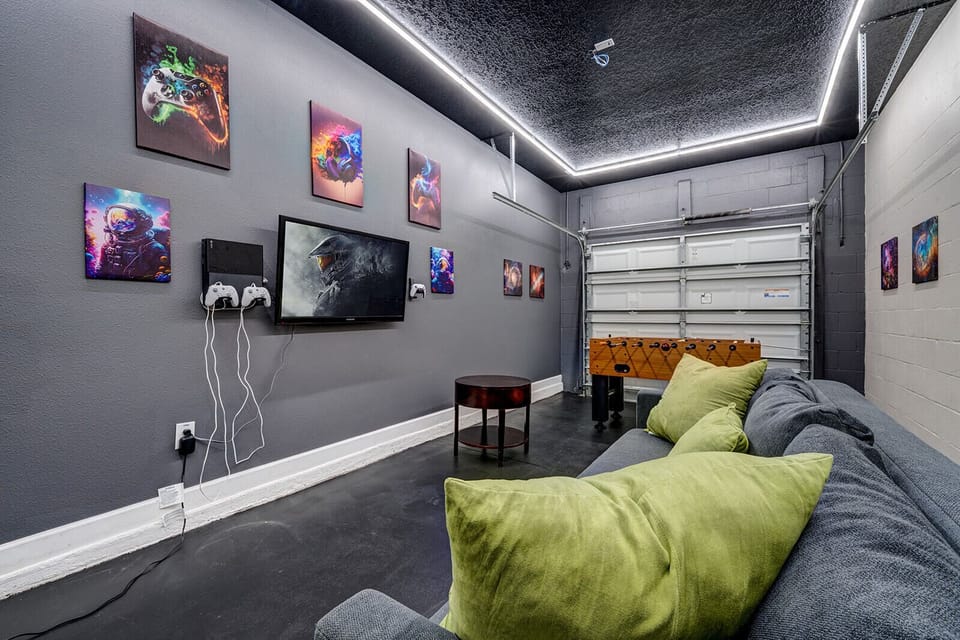Game room fun with PlayStation, foosball & cozy seating for endless play!