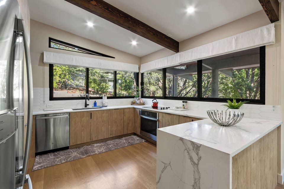 Modern kitchen, great tree-mendous views!