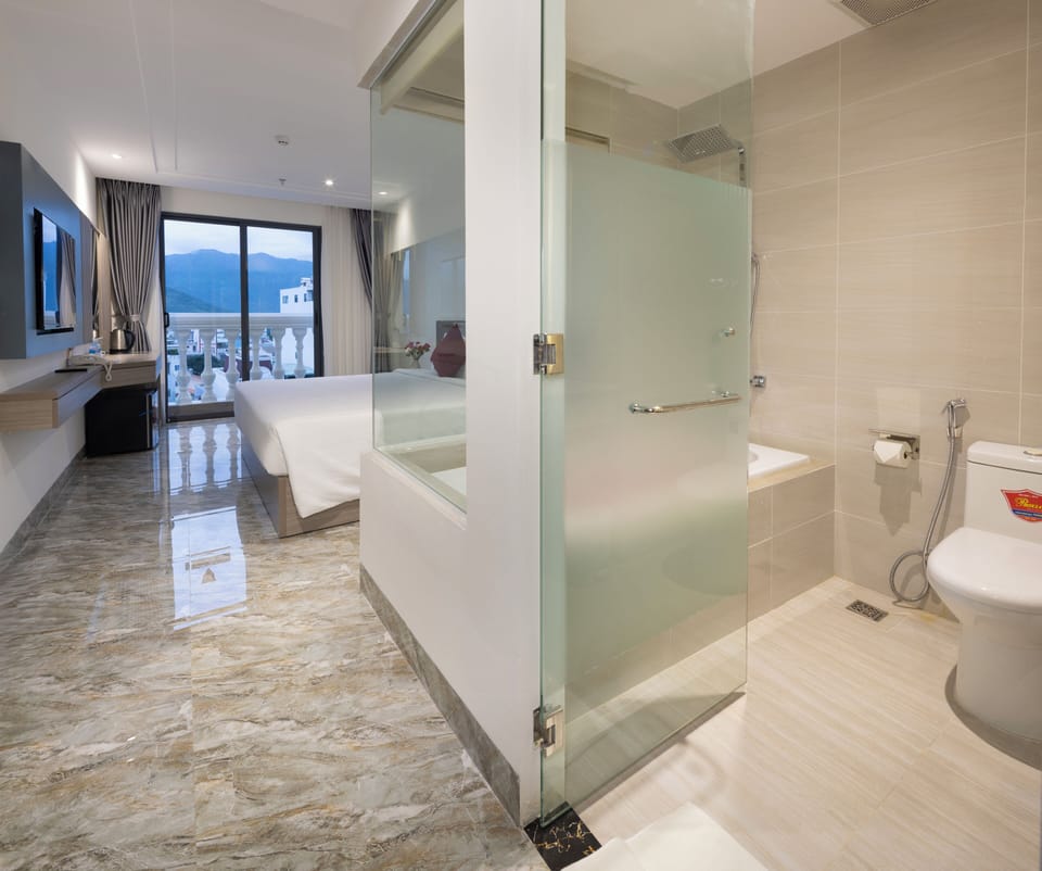 Deluxe Double Room, City View | Bathroom | Free toiletries, hair dryer, slippers, towels