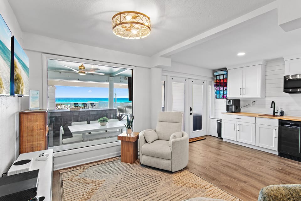 Green Reef 1 - Downstairs living space with comfortable seating, Xbox, Two TVs, electric fireplace, and Gulf Views!
