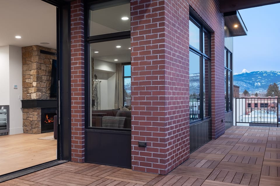 Grand (Penthouse) - Deck accessible from both the pool area and living room, perfect for indoor-outdoor entertaining.