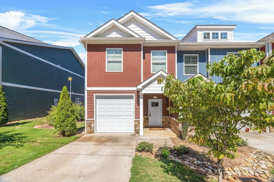 Welcome to your Spartanburg stay, featuring a modern facade with a private driveway and garage.