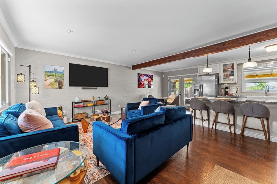 Open-concept layout — living room flows directly into the kitchen and bar seating.