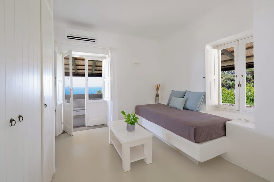 Panoramic Suite, Sea View | Living area | TV
