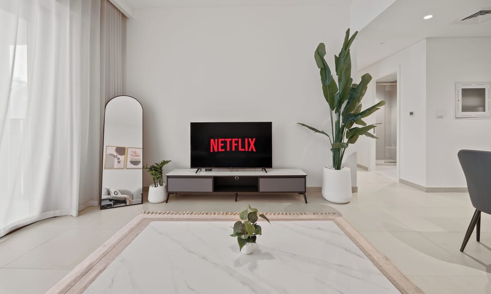Standard Apartment, City View | Living area | 55-inch Smart TV with digital channels, Netflix, streaming services