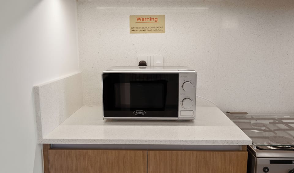 Standard Apartment, City View | Private kitchen | Coffee/tea maker, electric kettle, toaster, dining tables