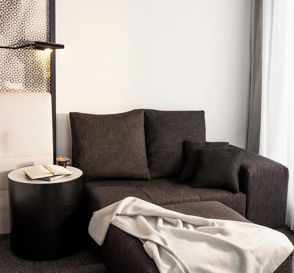 Curl up on the cozy sofa with a soft throw.