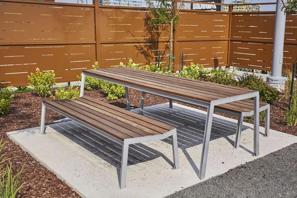Unwind outdoors with casual picnic-style seating and sunshine.