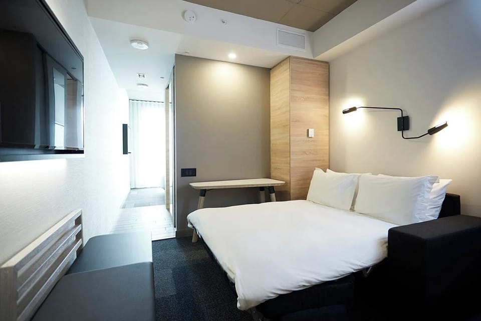 Wake up refreshed in a serene room with gentle natural light.