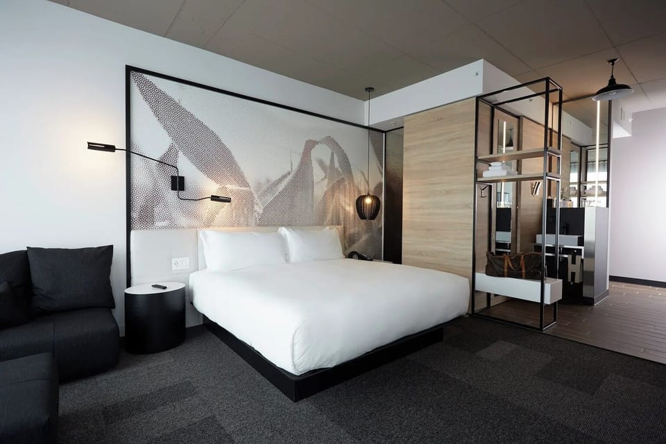 Stretch out in a spacious suite with designer lighting accents.