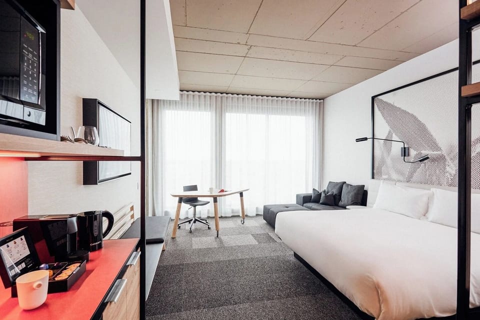 Settle in with a lounge corner and airy floor-to-ceiling curtains.