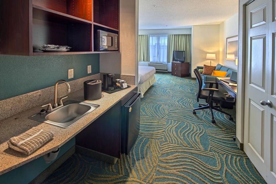 Start mornings with in-room coffee and handy kitchenette essentials.