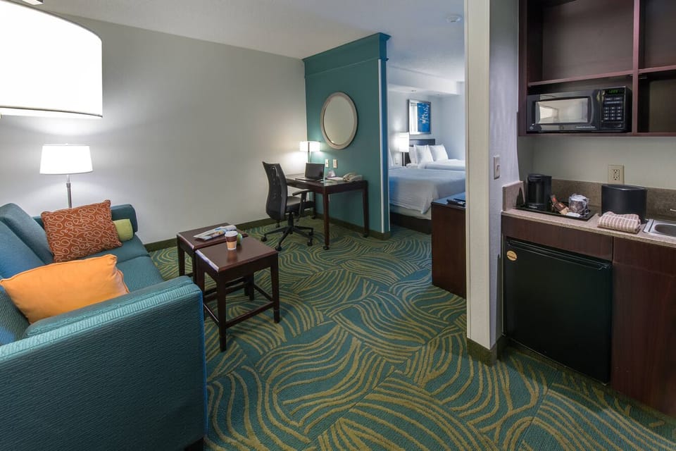 Unwind in a spacious suite with sofa and kitchenette comforts