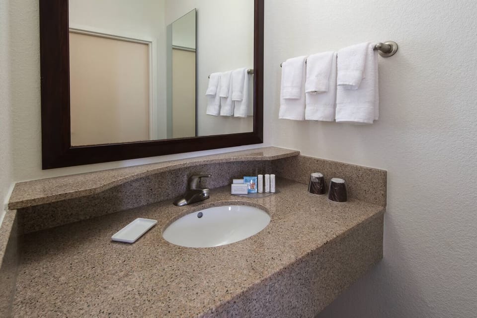 Get ready with a spacious vanity and bright mirror lighting.