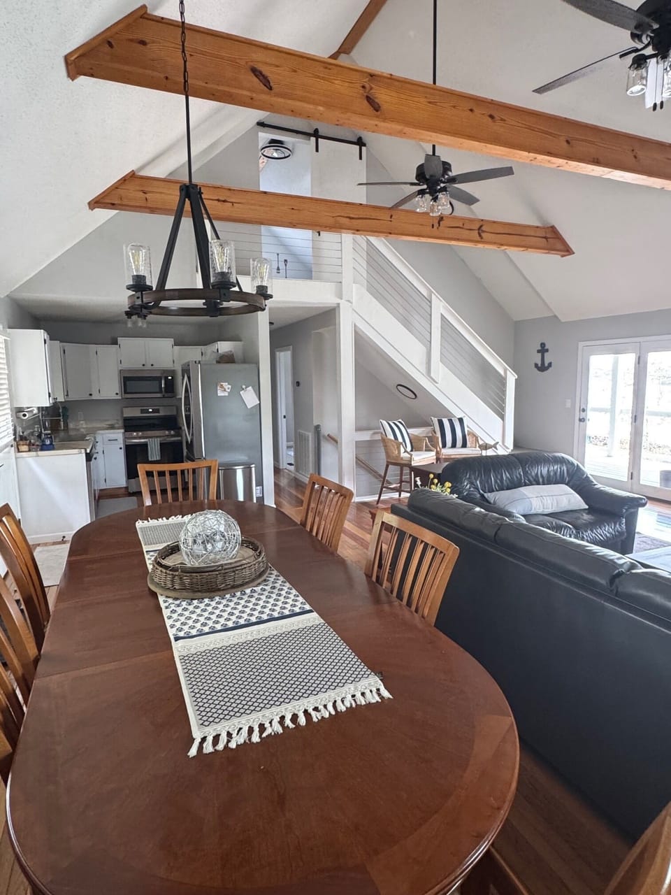 Open concept living/dining area. Large table with seating for 6.