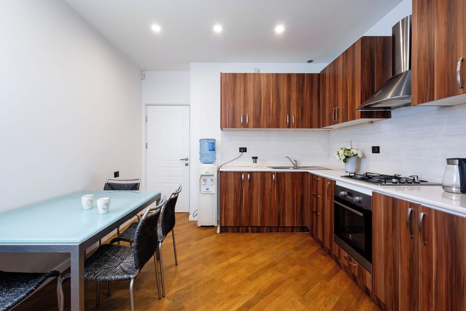 Apartment, 2 Bedrooms, Balcony | Private kitchen | Coffee/tea maker, electric kettle, cookware/dishes/utensils, freezer