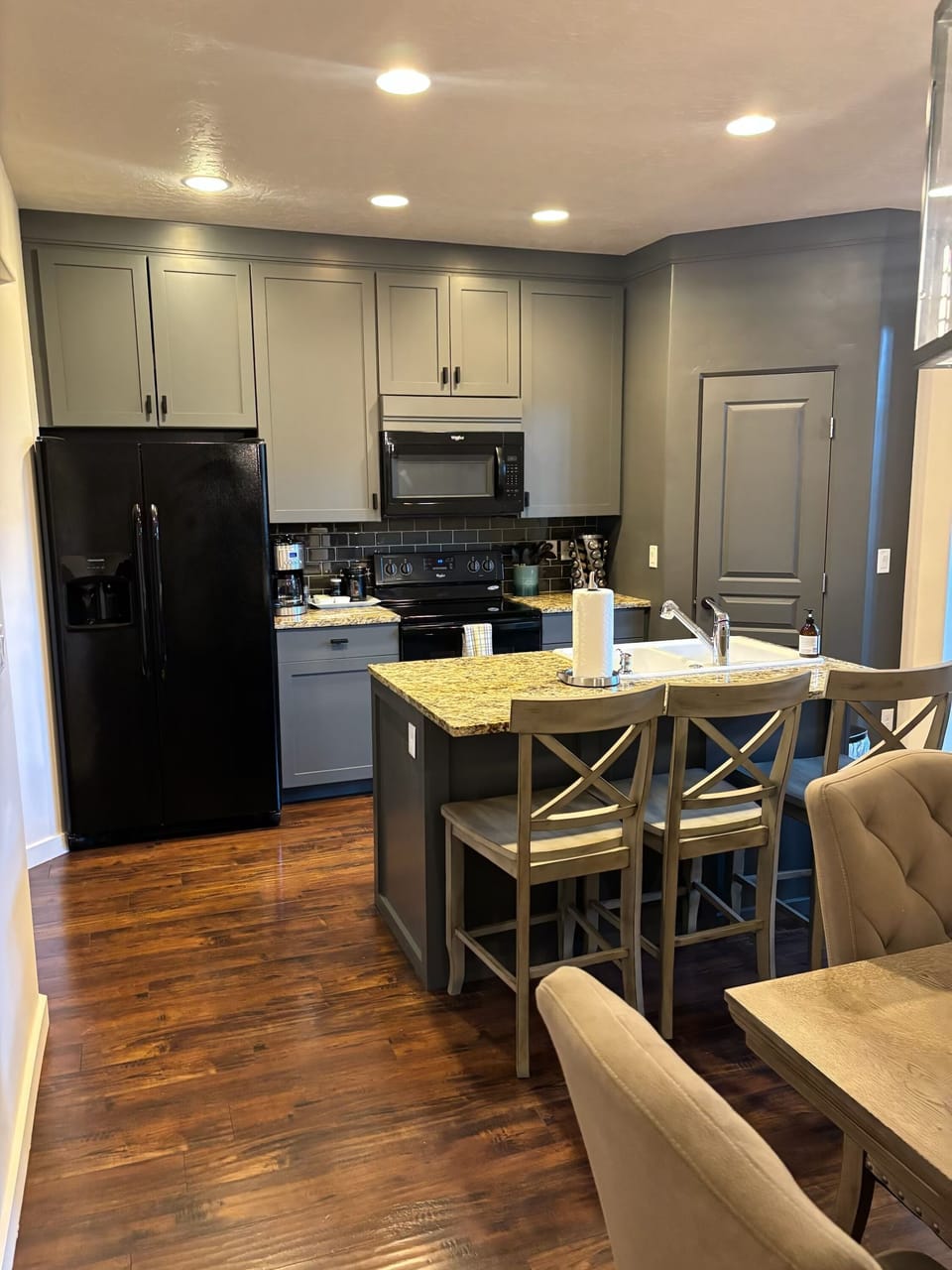 Relax in the open concept living room connected with kitchen and to large outside area