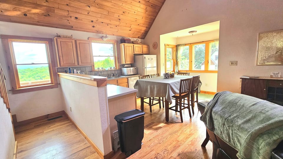 microwave, kitchen  interior, indoor, couch, refrigerator, living area, dining table, unit views