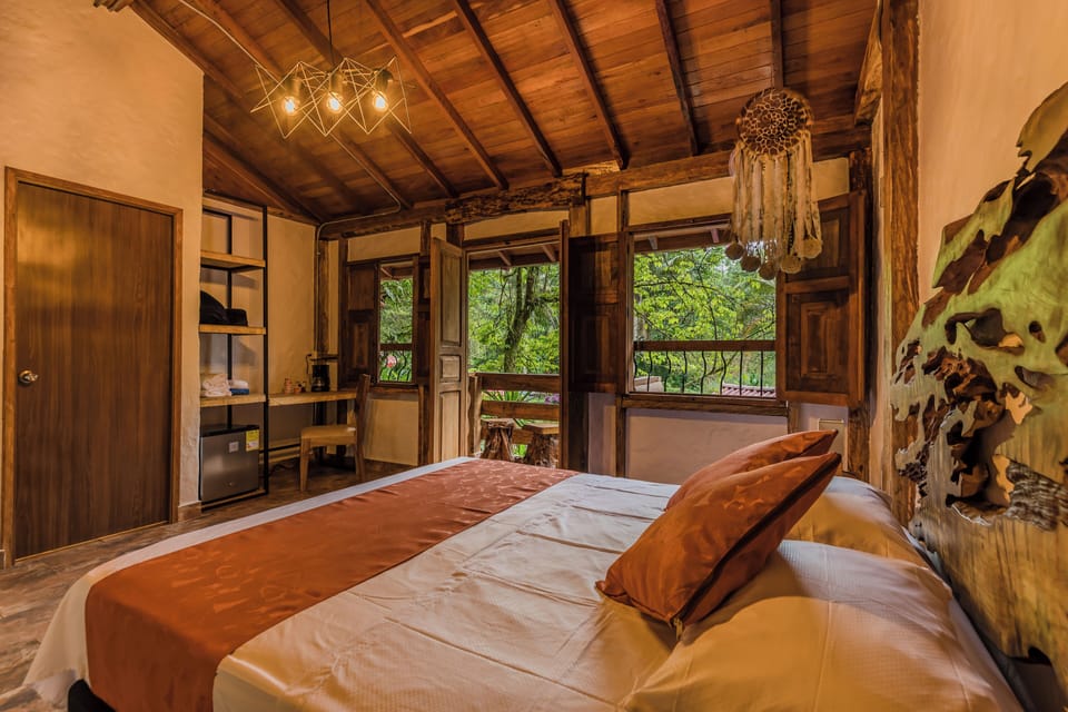 Luxury Cabin, River View | Minibar, in-room safe, individually decorated, individually furnished