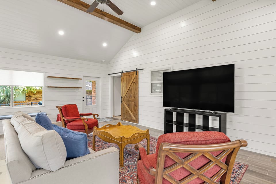 Bonus room.
Spacious wrap-around seating and 85" TV.