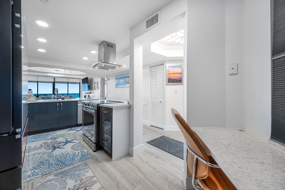 Open view from hallway into kitchen and dining