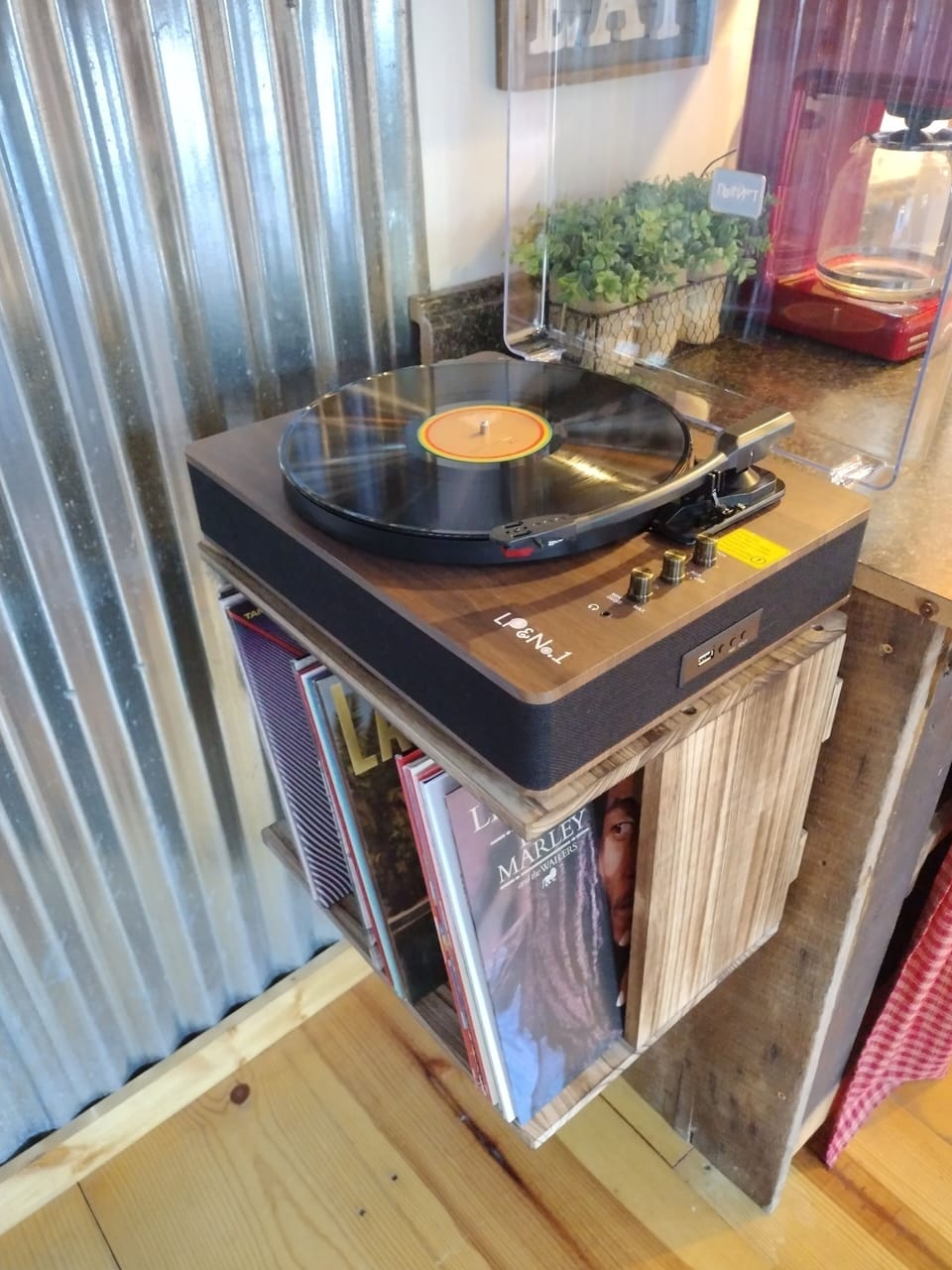 Record player and a great mix of albums. Also has blue tooth to play your tunes!