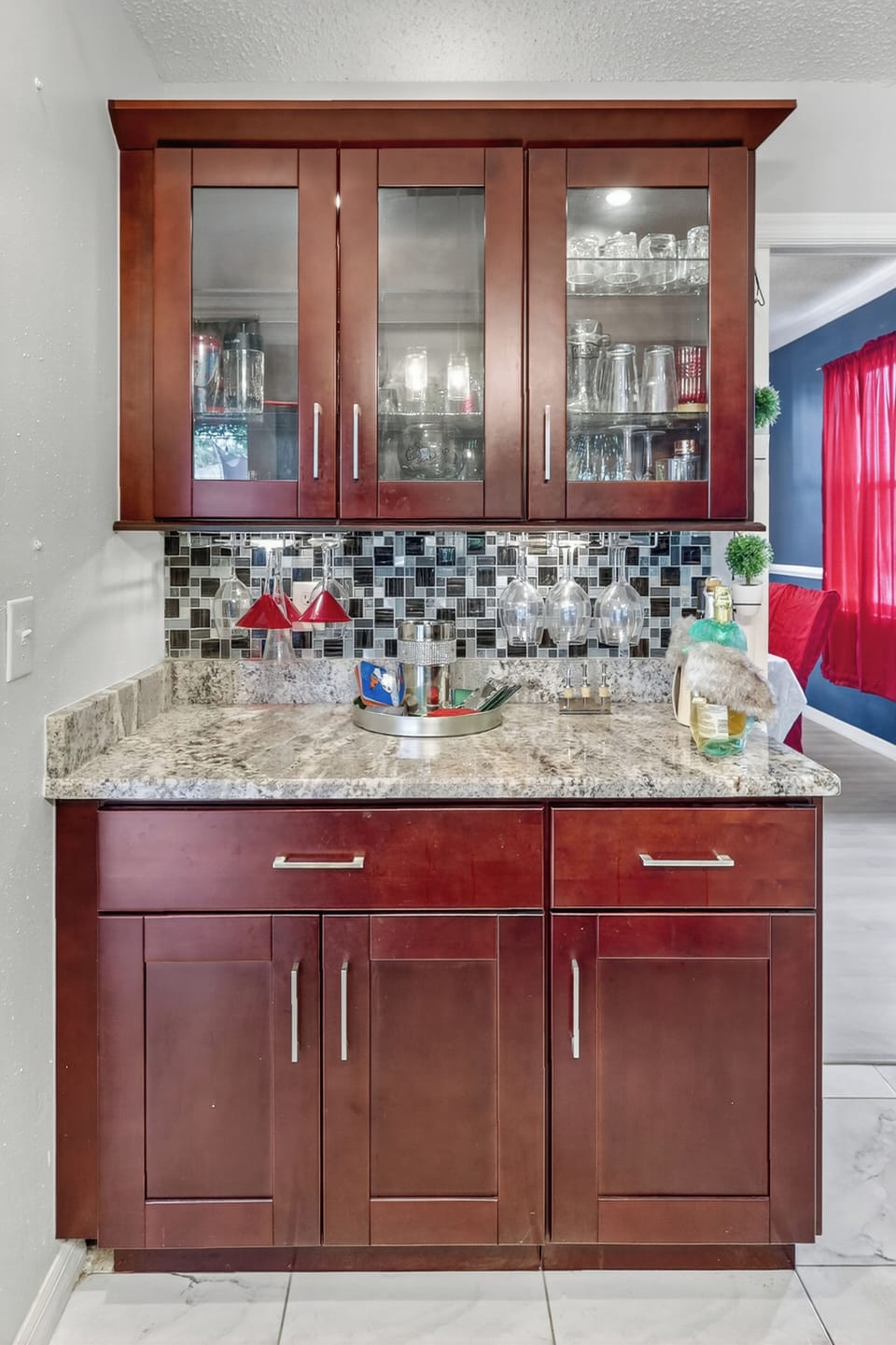 Mix drinks at your private wet bar with a wine glass rack.