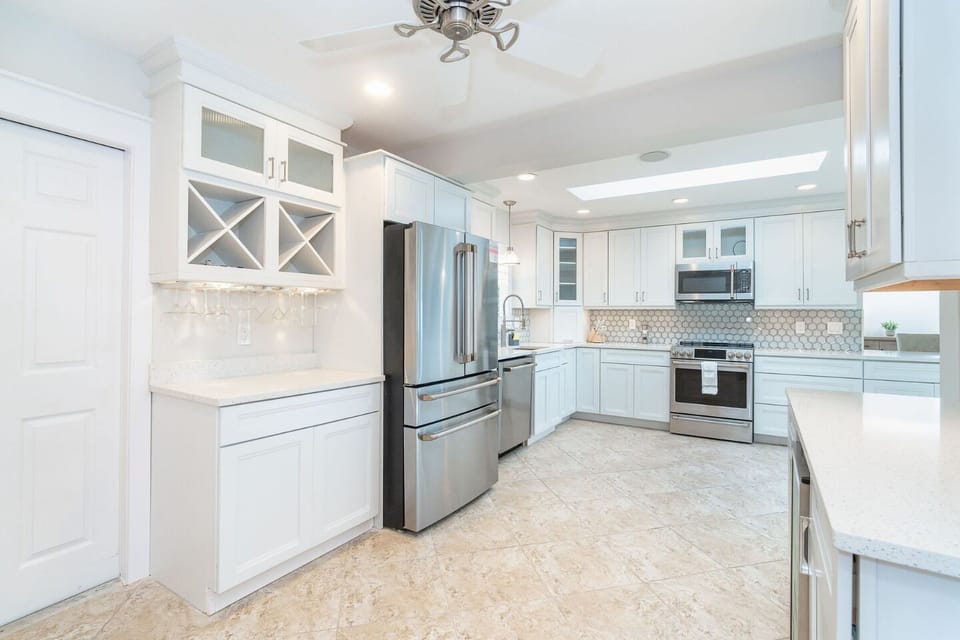 This newly renovated kitchen boasts stunning quartz countertops and modern amenities for your culinary adventures.