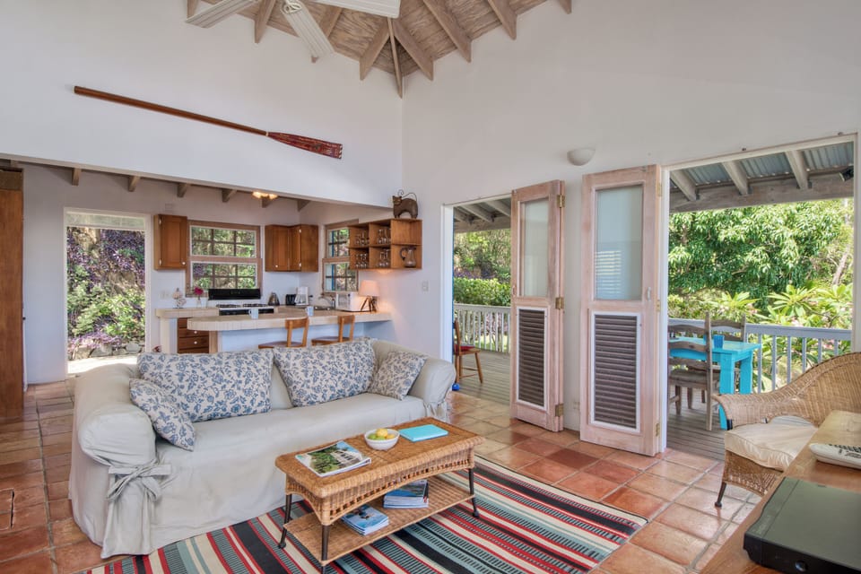 Open plan kitchen, living room with 3 seater sofa bed looking out to the garden.