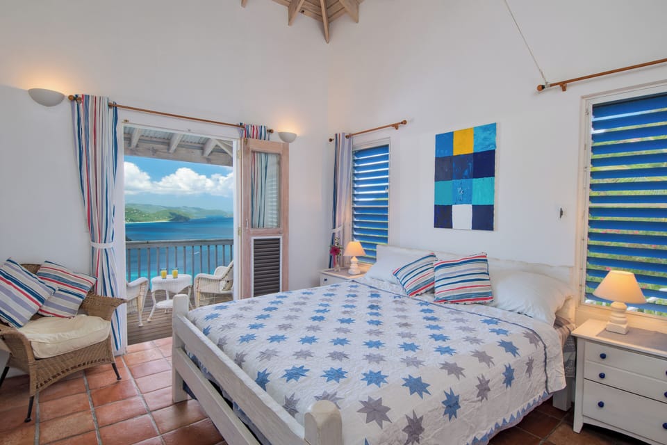 The master bedroom with king size bed and sea views over to Sage Mountain. 