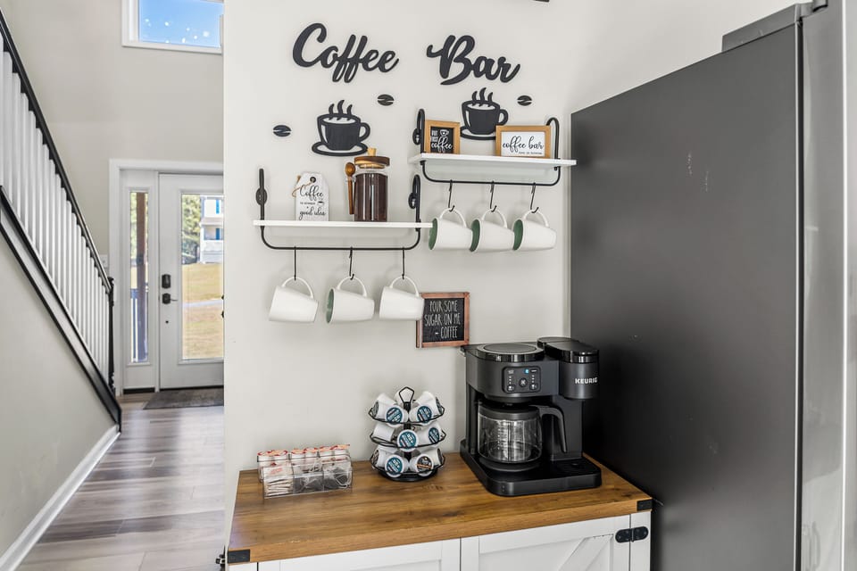 Coffee bar with drip coffee, K-cups, tea, hot chocolate and creamer